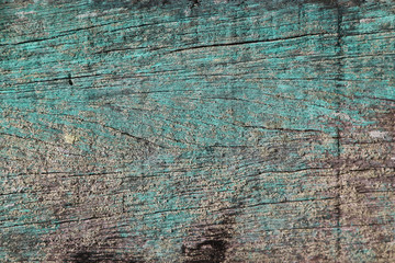 Closed up of flaking color wood plank's texture background.