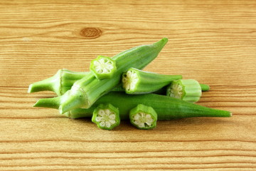 fresh okra vegetable in wooden table background