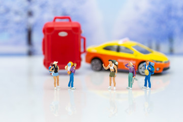 Obraz premium Miniature people: Traveler waiting vehicle for go to destination. Image use for transportation background concept.