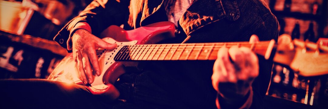 Young man playing guitar 