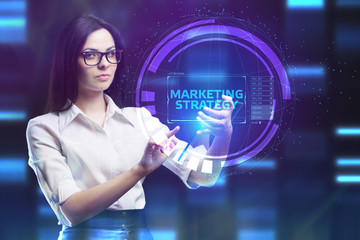The concept of business, technology, the Internet and the network. A young entrepreneur working on a virtual screen of the future and sees the inscription: marketing strategy