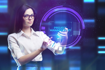 The concept of business, technology, the Internet and the network. A young entrepreneur working on a virtual screen of the future and sees the inscription: Project management