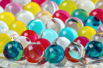 Multicolored jelly air freshener balls. Colorful abstract background