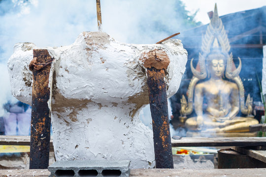 Molten metal is poured into a sand mold aluminum casting and the Buddha temple is The ceremony of pouring Buddha image in Phitsanulok Thailand.