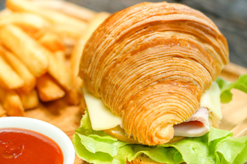 Croissant ham cheese delicious breakfast on wooden table