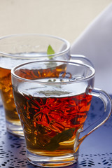 Two glasses of tea on the blue table