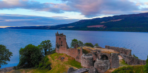 Loch Ness and Urquhart Castle in the evening - aerial view