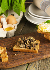 Scrambled eggs with herbs on wheat-rye crispy bread, homemade