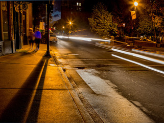 Deep shadows and light flares on dark street.in Asheville, NC