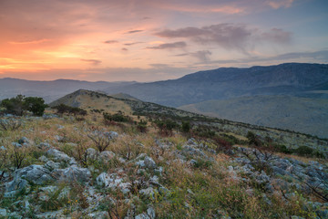 Mountain view at sunset somewhere in Croatia,rocks and grass,long exposure