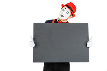happy MIME artist holding a blank white Board, on a white background