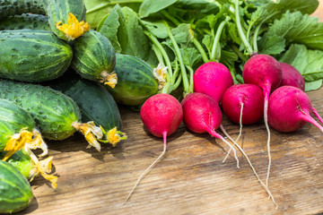 Fresh vegetables radishes, cucumbers on the table. Healthy food. Copy space. view from above. close-up