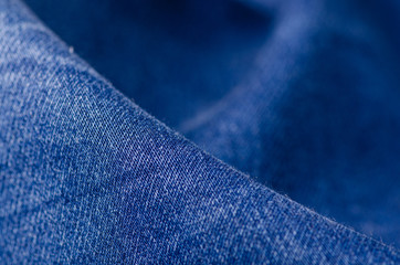 Blue jeans fabric macro texture fashion on blur background