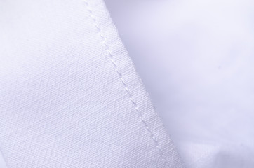 White shirt fabric macro material clothes detail on blur background