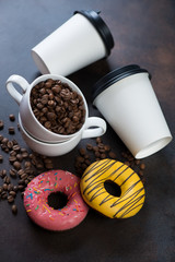 Coffee with donuts for breakfast on a brown metal background, selective focus, studio shot