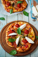 pizza with zucchini flowers . Top view.