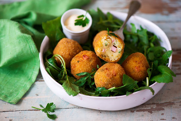 potato croquettes with mortadella.style rustic