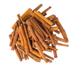 Pile of cinnamon sticks isolated on white background