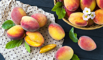 Fresh ripe peaches on paper