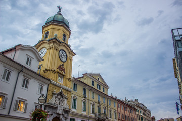 old city street catholic tower church in evening twilight time