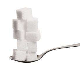 Spoon full of sugar cubes