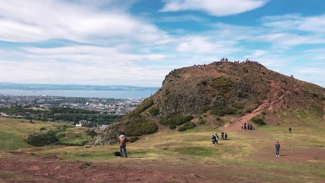 Tourists on the peak of Arthur's Seat in Edinburgh (4k / 60fps)