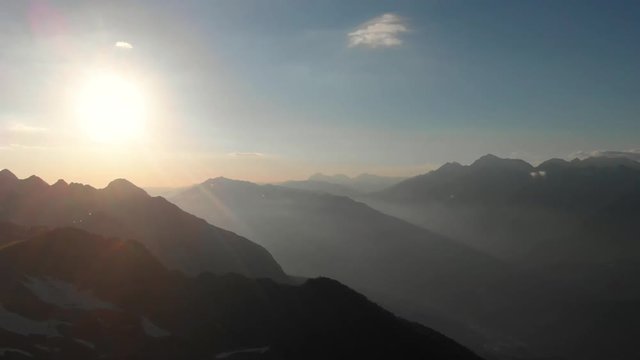 Flight of the camera over mountains at sunset. Aibga Ridge. Mountain Kamennyy stolb. 2509m. Mountains near the ski resort of Rosa Khutor in Krasnaya Polyana. Sochi, Russia. part 2