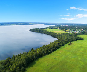 Aerial view of seashore with beach, lagoons. Coastline with sand and water. Tropical landscape. Aerial photography. Birdseye. Lake, beach, sky, clouds.
