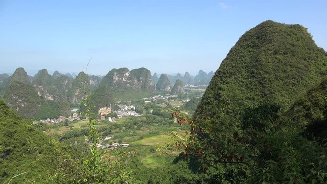 Scenic countryside with karst hills from the summit of Moon Hill of Yangshuo county. Guilin, Guangxi Zhuang, China 