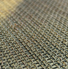 Wire metal mesh or grille. Perspective and blur. Industrial background