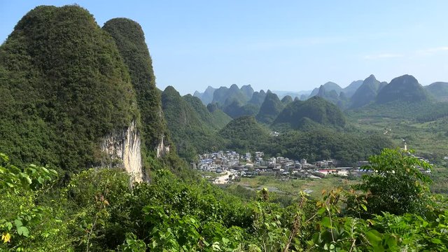 Scenic countryside with karst hills from the summit of Moon Hill of Yangshuo county. Guilin, Guangxi Zhuang, China 