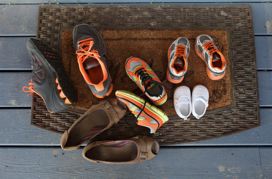 Family Shoes At The Front Door Step