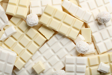Chocolate pieces and coconut candies background