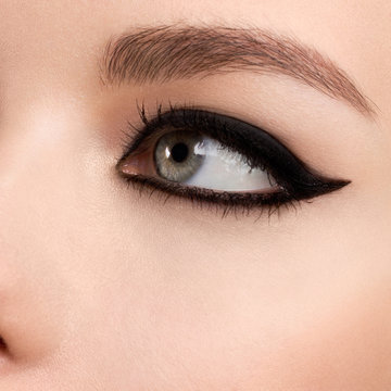 Beauty makeup for blue eyes. Part of beautiful face closeup. Perfect skin, long eyelashes. Make up concept.