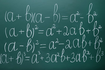 Maths formulas on chalkboard background