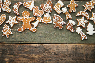 Christmas gingerbread cookies on grey wooden table