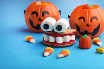 Halloween cookies mouth with marshmallows on blue background