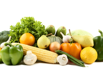 Ripe fruits and vegetables on white background