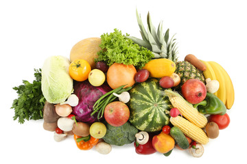 Ripe fruits and vegetables on white background