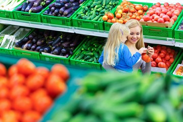 Mother and Daughter Shopping in Supermarket