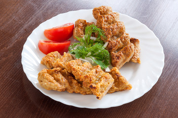 Grilled Lula kebab in a white dish