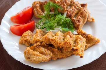 Grilled Lula kebab in a white dish