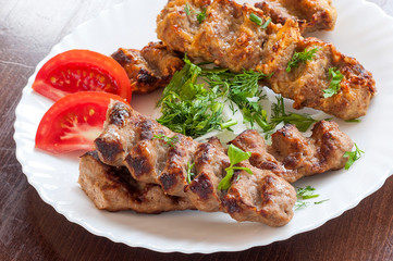 Grilled Lula kebab in a white dish