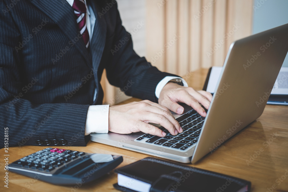 Poster professional at work, businessman writing report and using laptop working analysis investment connec