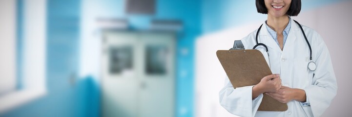 Composite image of doctor holding clipboard against grey