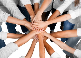 Top View of People in Circle with Their Hands Together