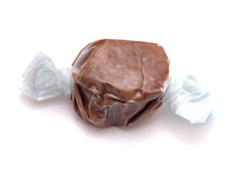 Single Piece of Chocolate Salt Water Taffy on a White Background
