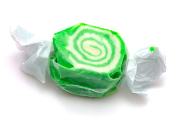 Single Piece of Green Salt Water Taffy on a White Background