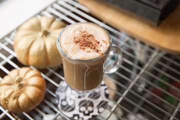 Cinnamon sprinkled on latte