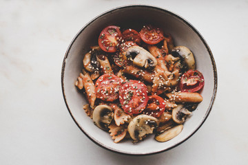 Pasta with tomatoes and mushrooms